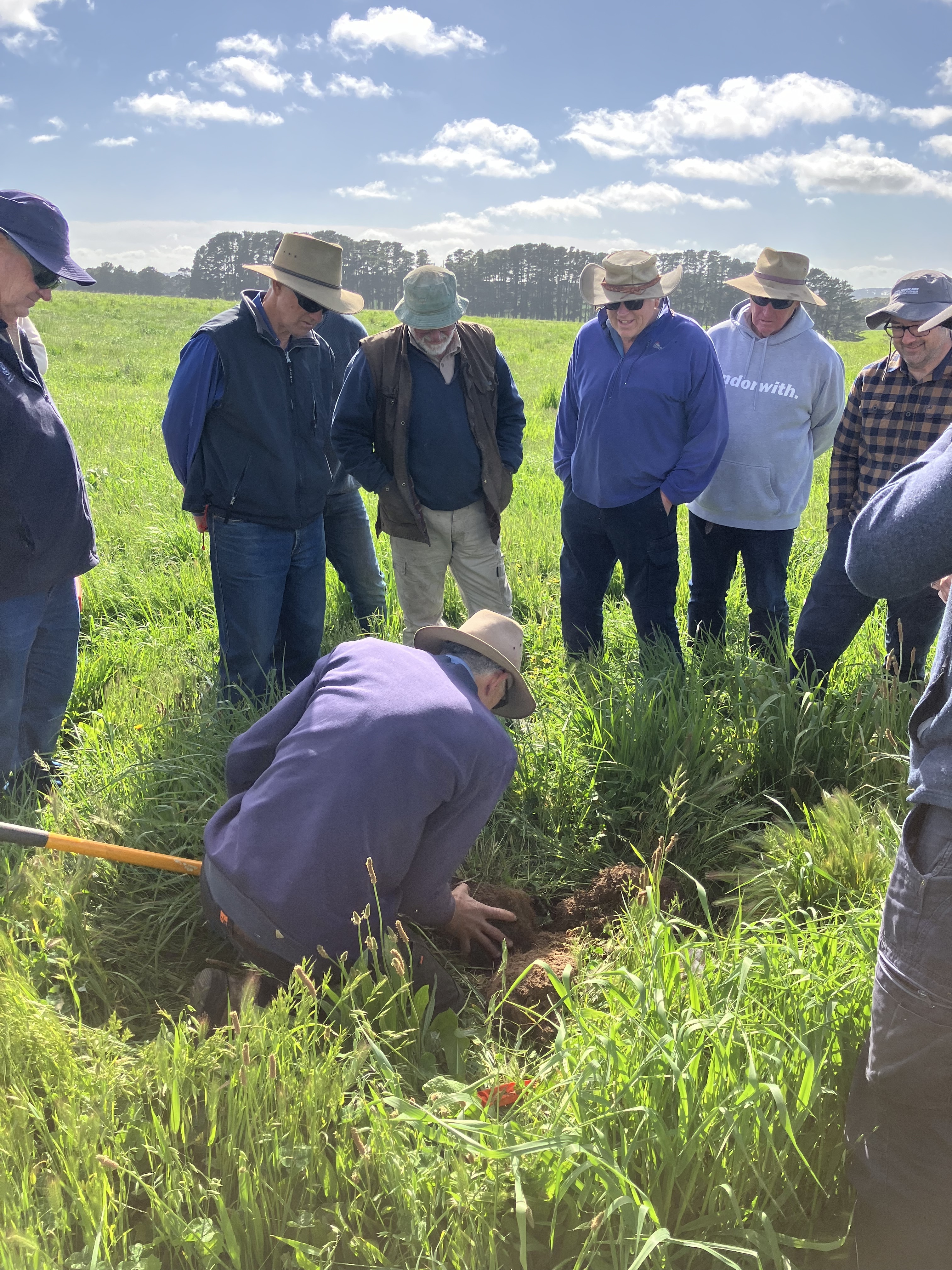 19 Farmers inspecting the soil up close